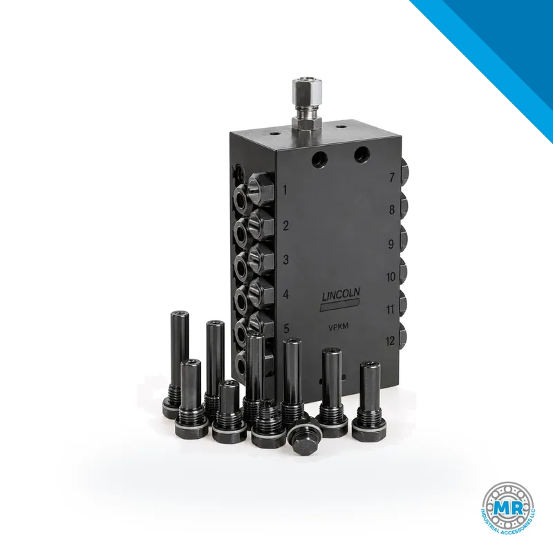 Válvula divisora metálica rectangular con múltiples salidas roscadas y cuerpo de acero · SKF LL/649-29537-1