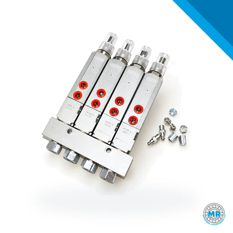 Grease manifold distributor with four injectors on a rectangular steel block · SKF LL/85770-4