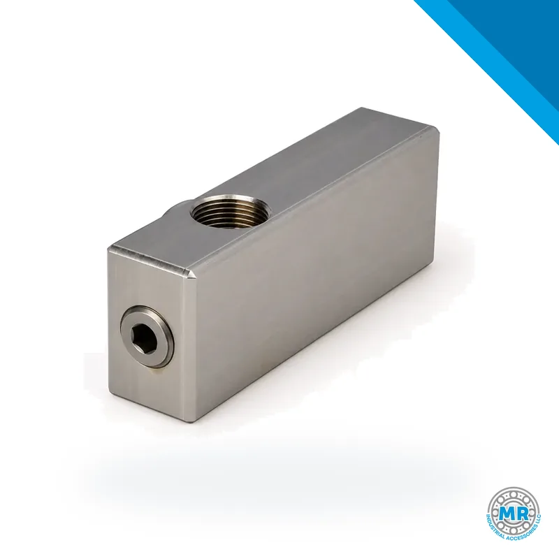 Steel hydraulic adapter block with threaded connections · SKF 1013523 E